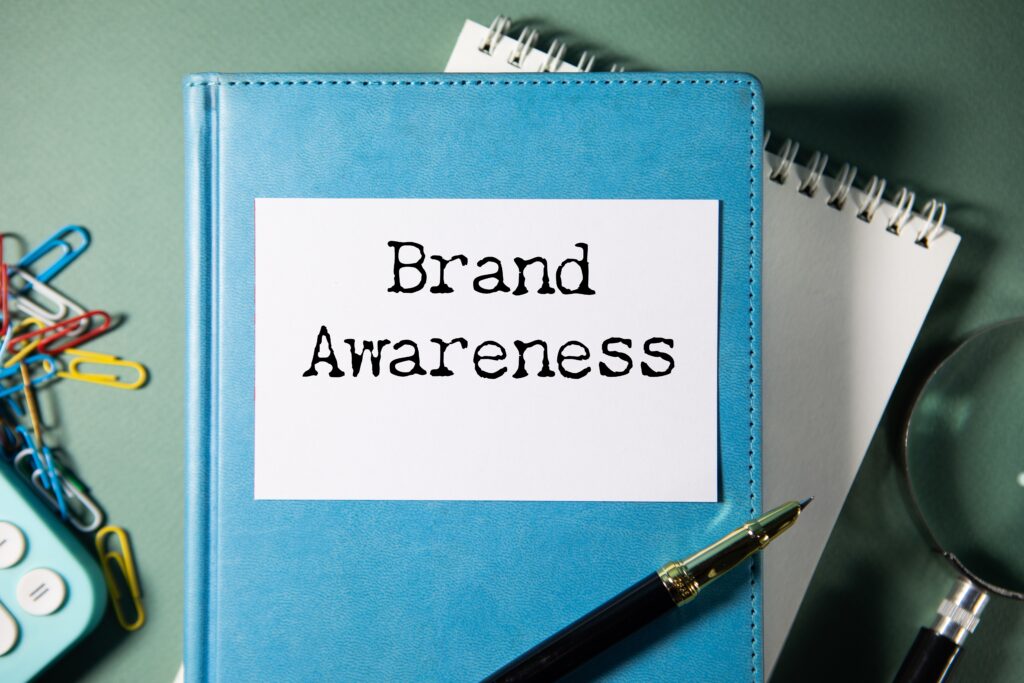 Text on a notebook showing inspiration and brand awareness campaign focus.