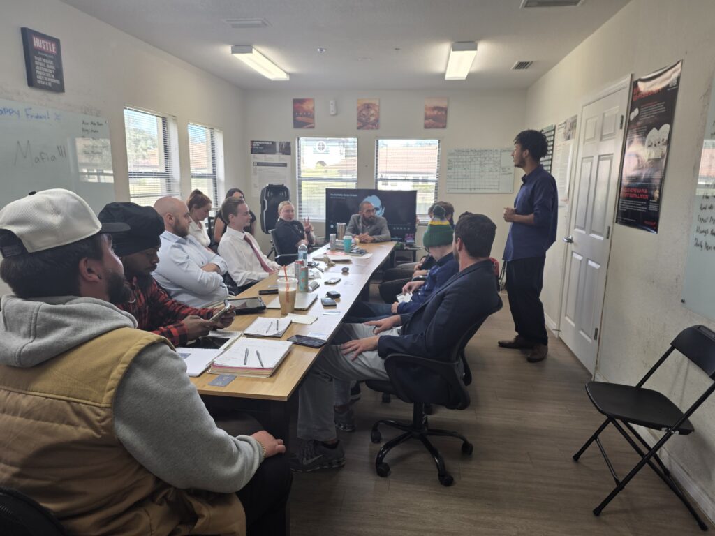Team members collaborating during a professional development meeting in the office.