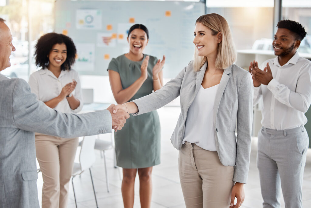 A team welcoming a new hire in a positive workplace.