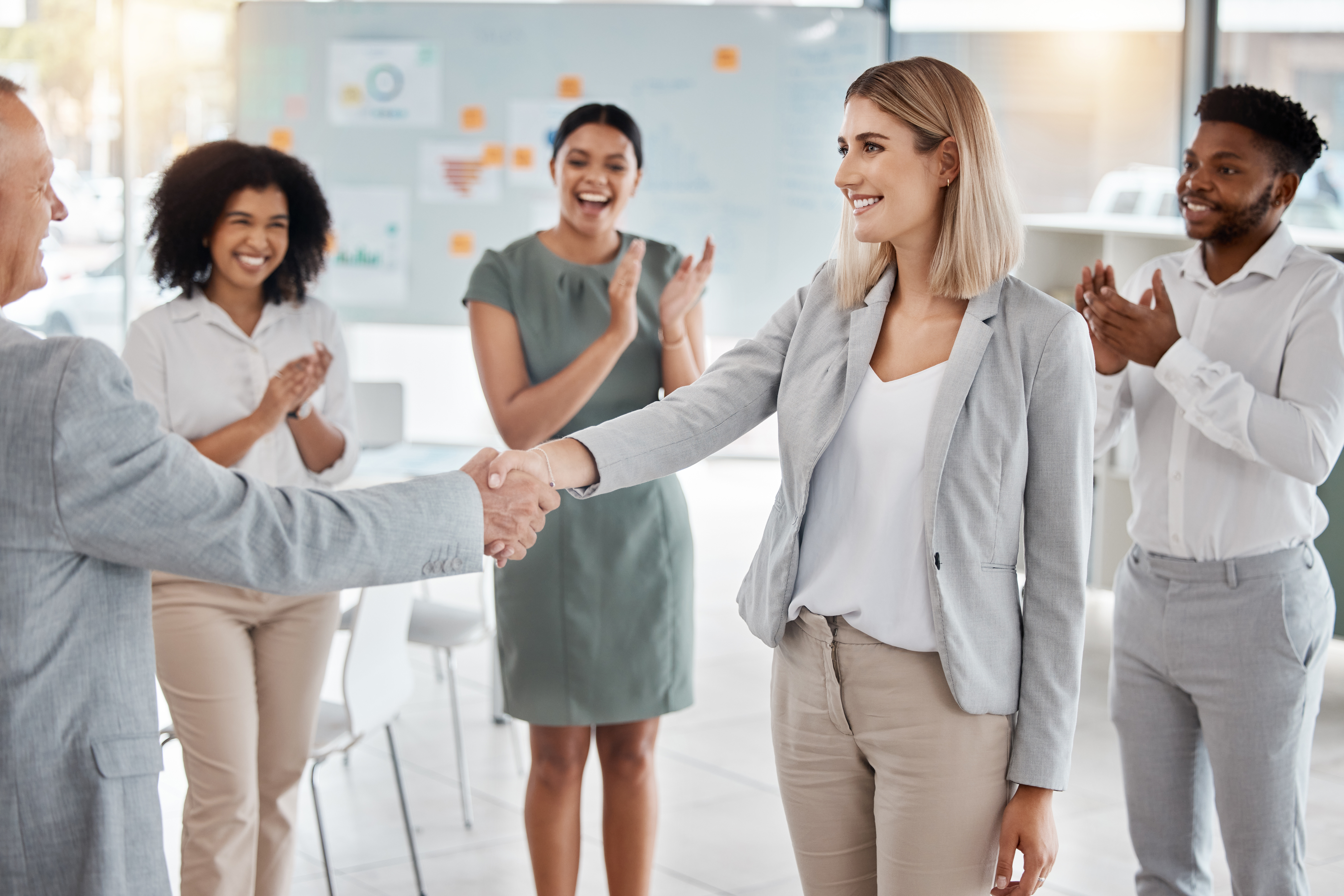 A team welcoming a new hire in a positive workplace.